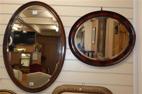 Two oval wood framed wall mirrors, together with an oval gilt framed wall mirror (3) Largest 82cm